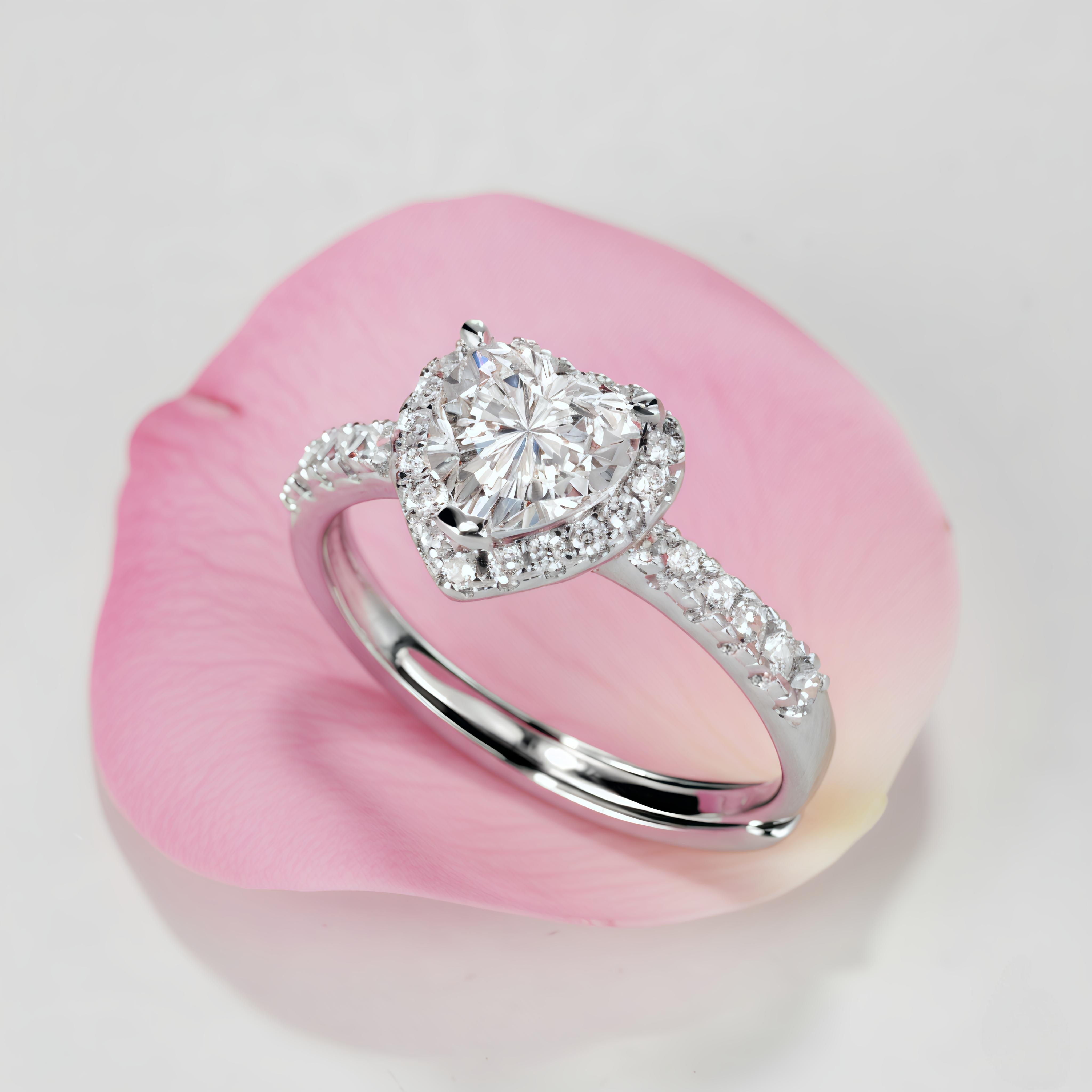 Diamond ring on a pink shell with a soft focus background